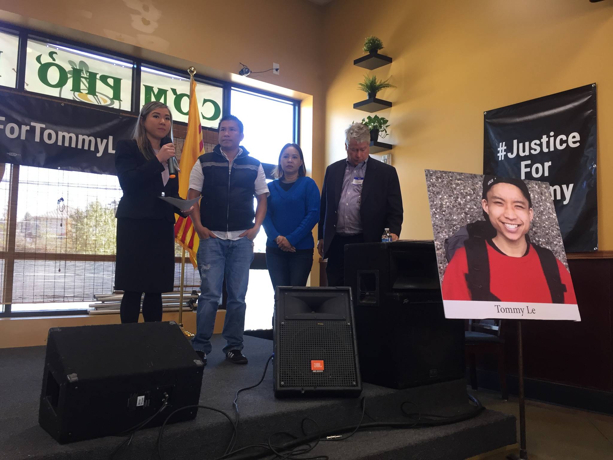 Le family attorneys Linda Tran and Jeff Campiche stand on either side of Tommy Le’s parents, Hoai Le and Dieu Ho, at the Dat Lat Quan Vietnamese restaurant in White Center on Oct. 14. Photo by Josh Kelety