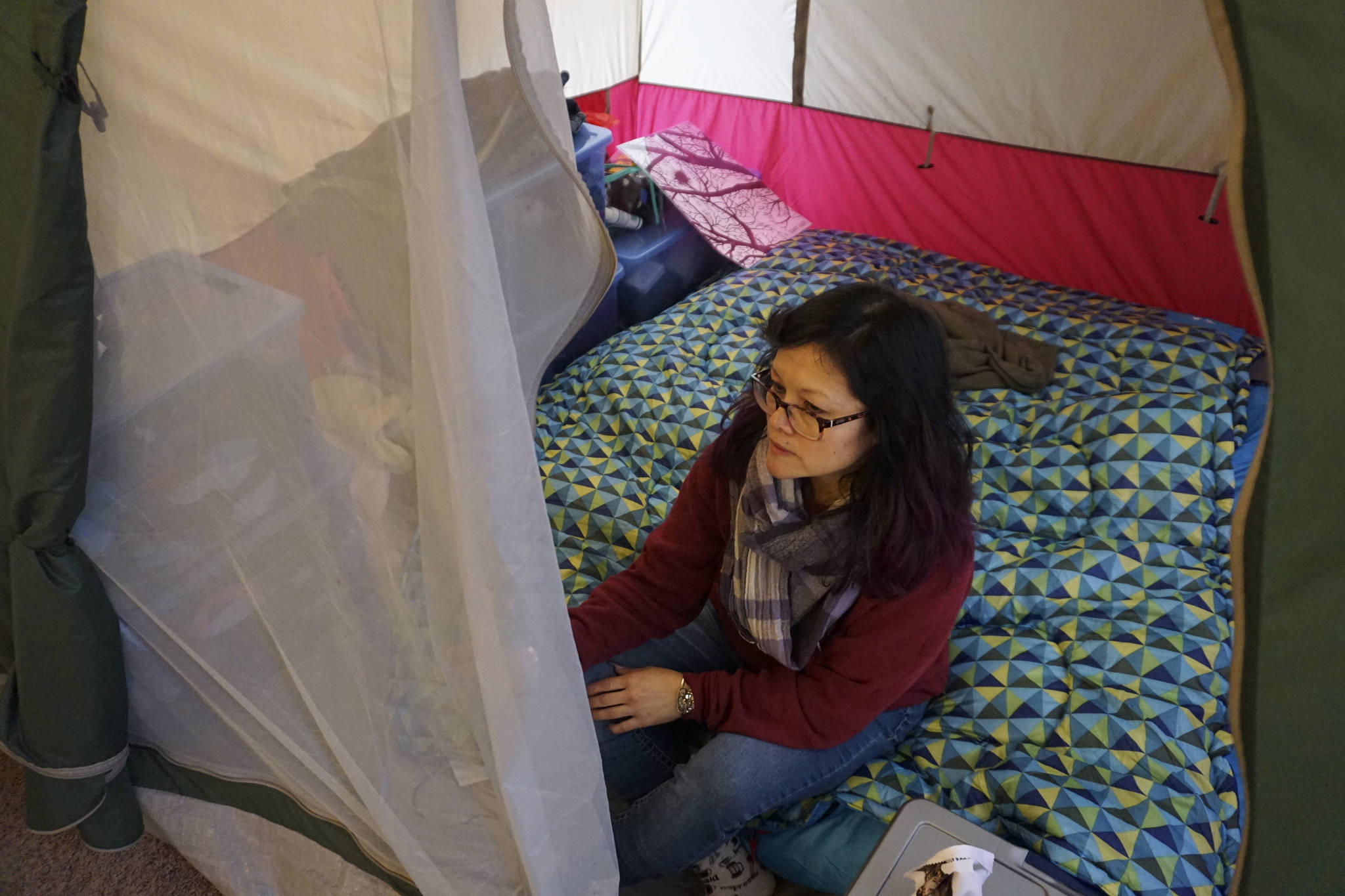 Photo by Melissa Hellmann                                 Christy X lives in a tent inside her apartment because she says that pests make the unit uninhabitable.