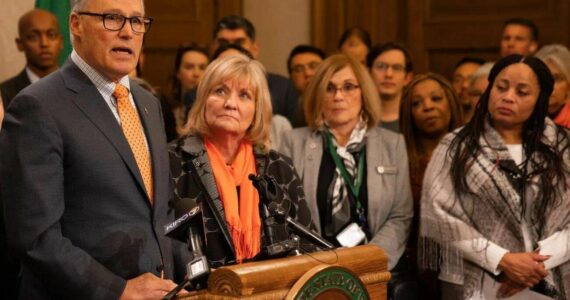 Gov. Jay Inslee, left, with First Lady Trudi Inslee at a press conference advocating for laws to prevent gun violence. (Provided by the Washington State Governors’ Office)