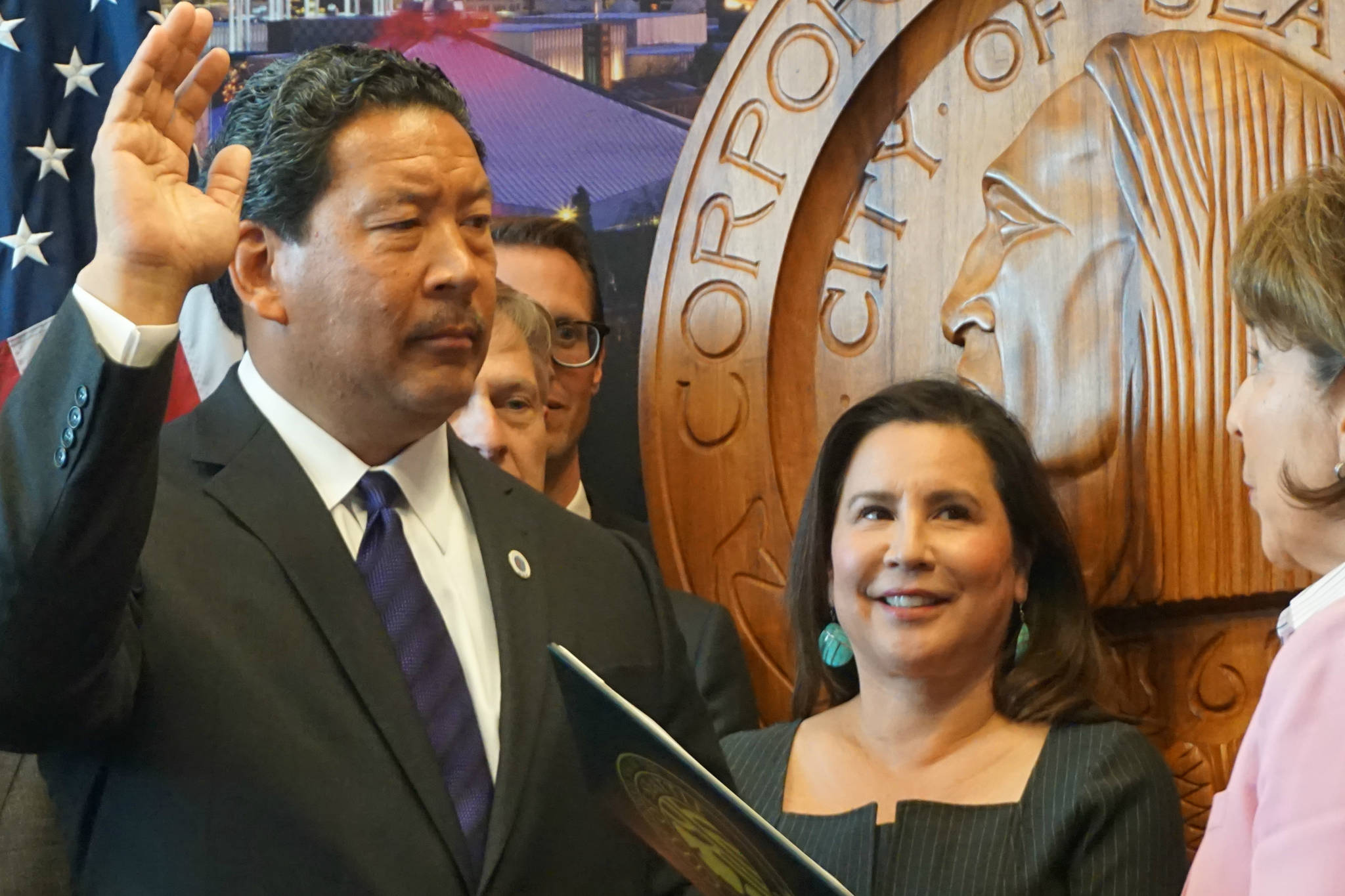 Seattle City Council president Bruce Harrell takes the oath of office as acting mayor of Seattle. Left to right: Mayor Harrell, City Attorney Pete Holmes, District 4 Councilmember Rob Johnson, District 5 Councilmember Debora Juarez, and City Clerk Monica Martinez Simmons. Photo by Casey Jaywork